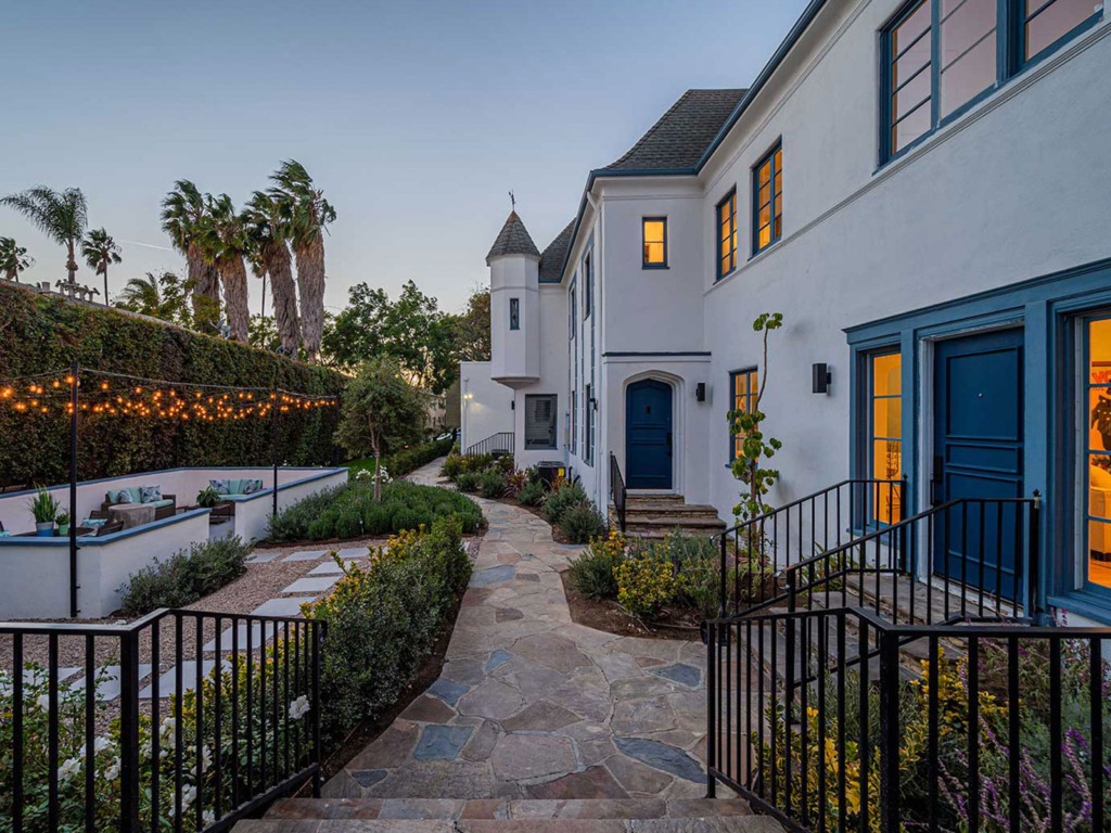 Side yard view at dusk of The Hayworth property