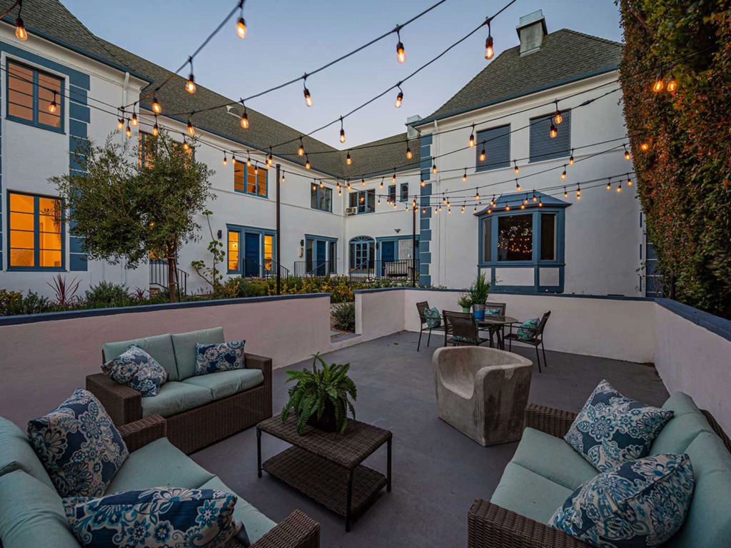 Back yard patio view at dusk of The Hayworth property