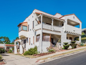 Santa Fe style multifamily home on a steep hill